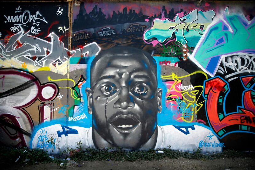 Artist Trey Wilder painted a mural including Dallas Cowboys quarterback Dak Prescott on one...