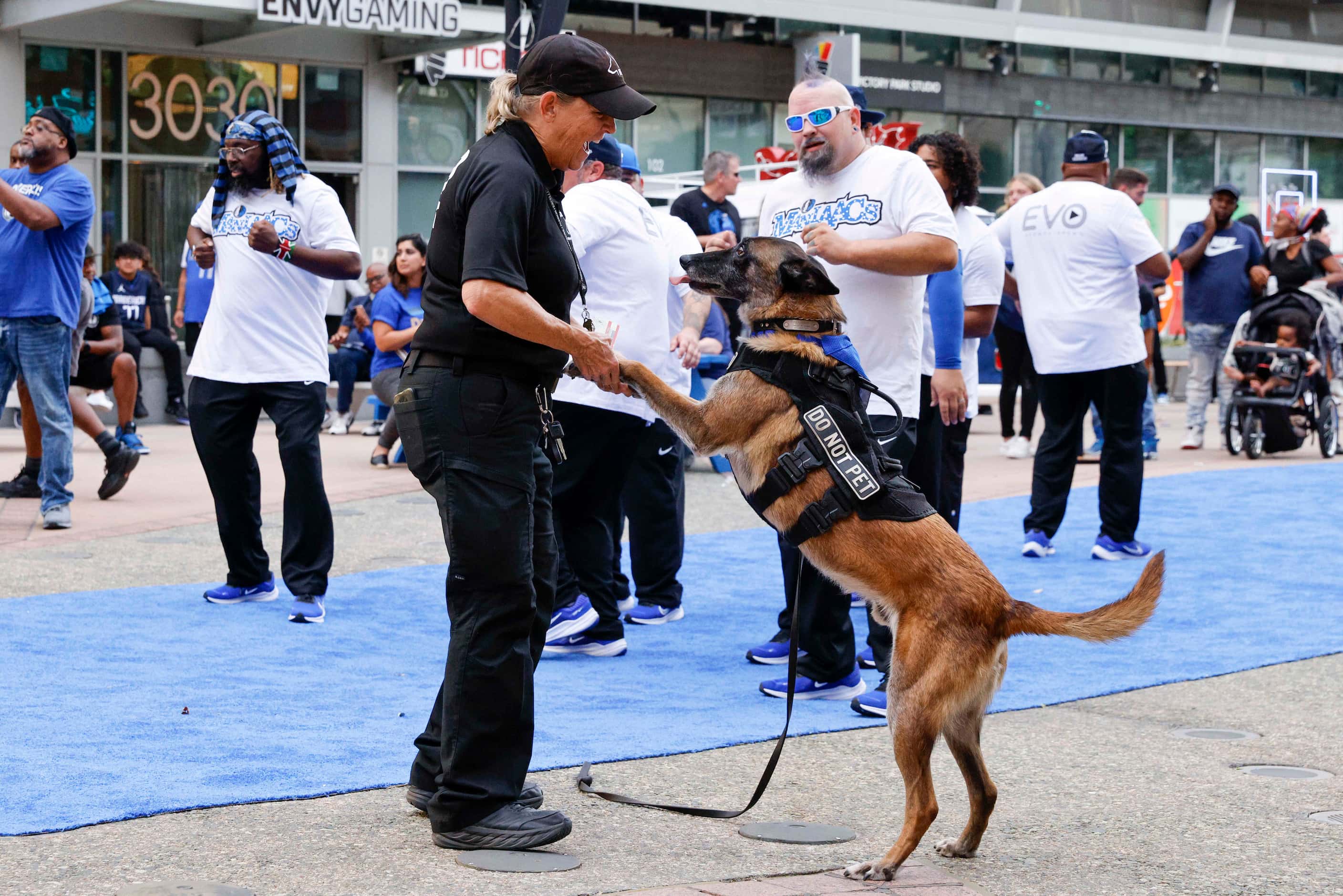 Maureen Cooke, K9 Security Detection Services owner, dances with her dog Boomer alongside...