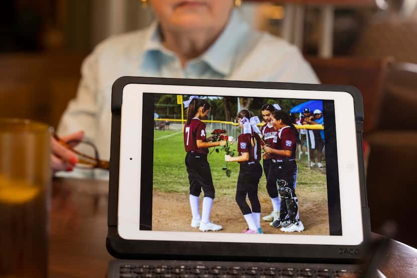 Former Uvalde cheerleader Jill Stoy shows a photo of her granddaughter, Gina Gatto, getting...