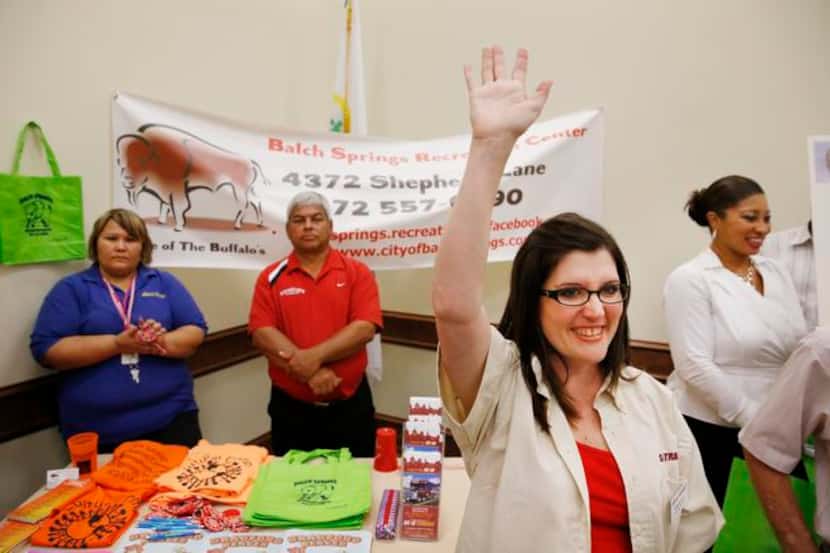 
STAR Transit marketing manager Kim Britton waves as she’s introduced to Balch Springs...