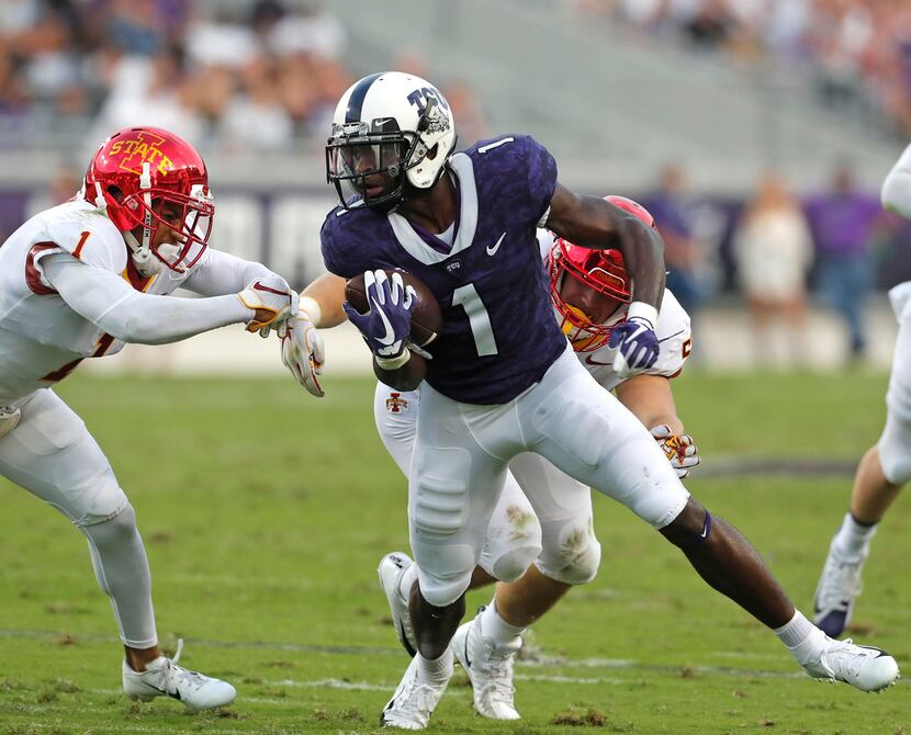 FILE - TCU wide receiver Jalen Reagor (1) is brought down by Iowa State defensive back...