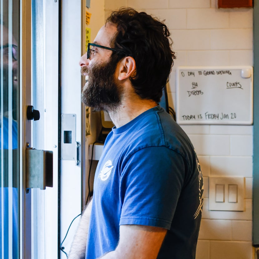 Starship Bagel owner Oren Salomon greets customers during opening day in downtown Dallas on...