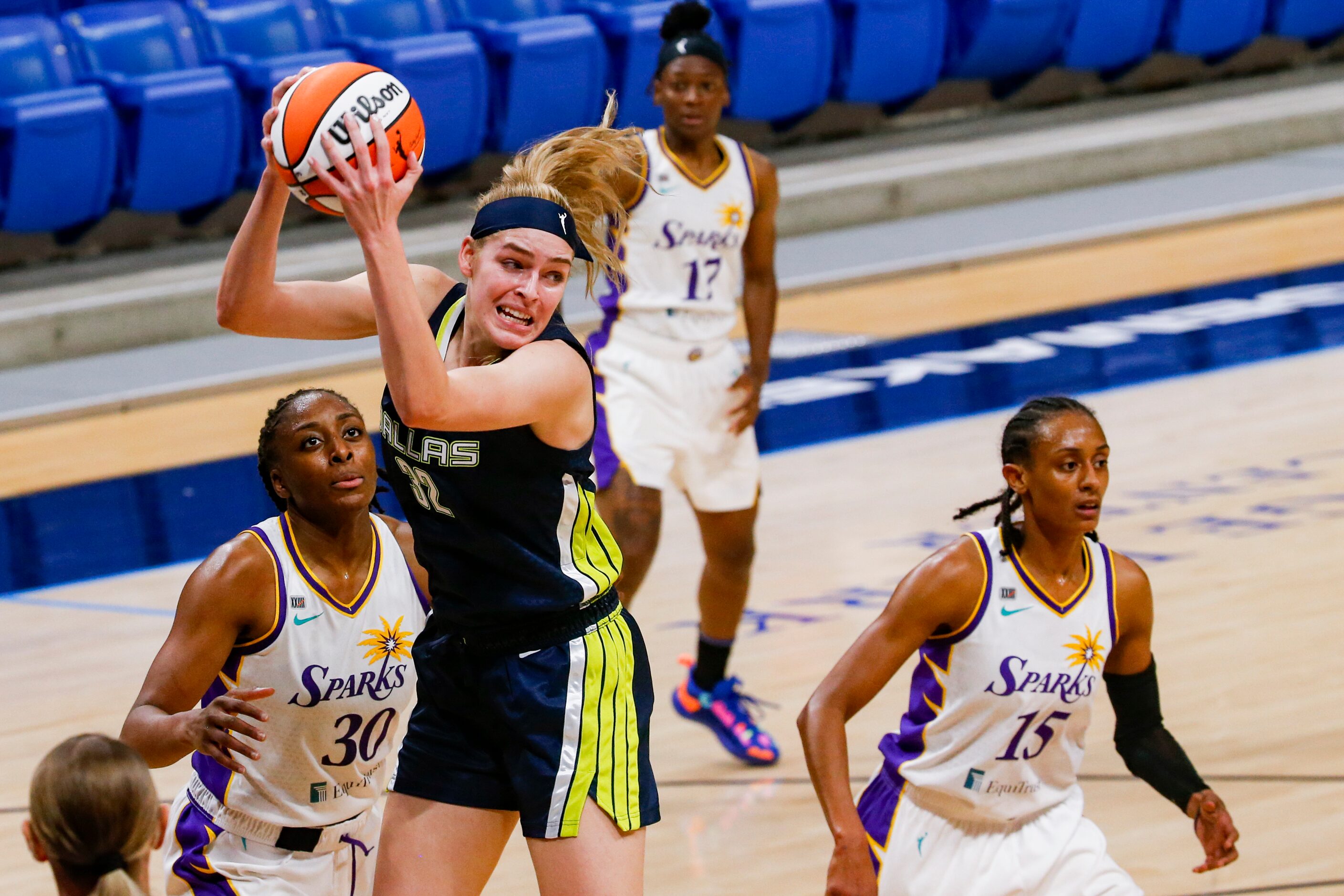 Dallas Wings center/forward Bella Alarie (32) grabs a Dallas Wings rebound against the Los...