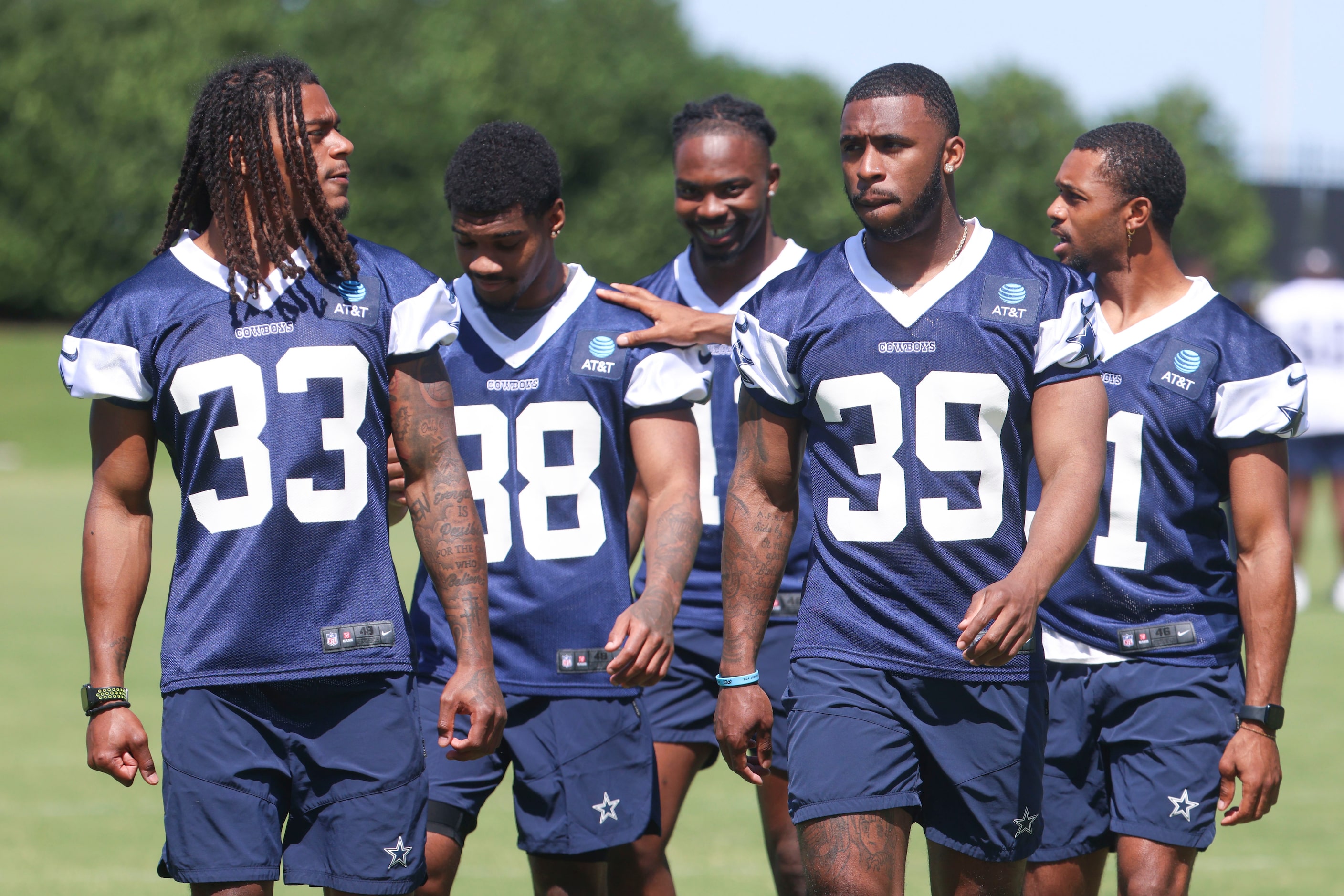 Dallas Cowboys defensive backs Julius Wood (33), Emany Johnson (39), Josh DeBerry (back...