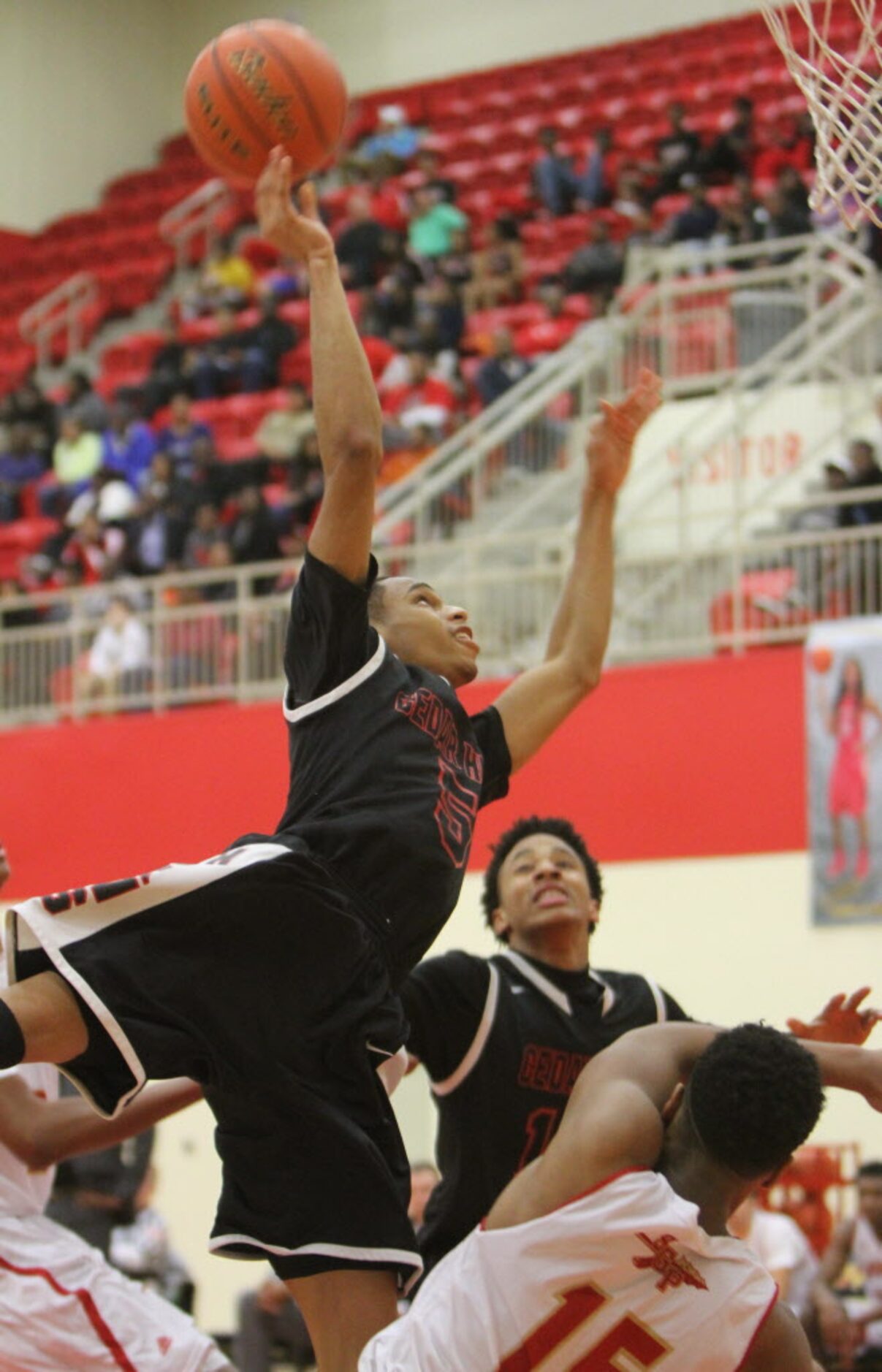 Cedar Hill guard Kealon Clayborne (5) follows through with his shot after being fouled by...