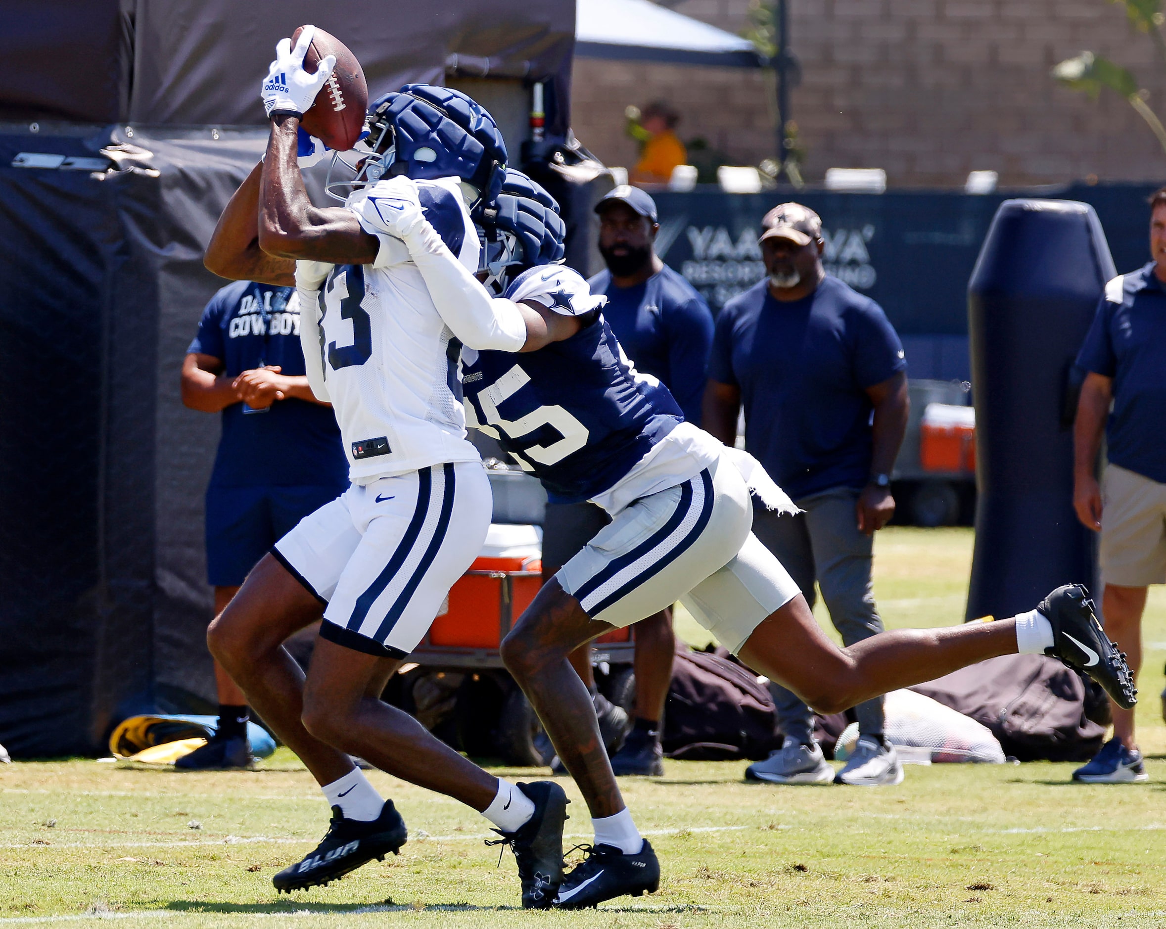 Dallas Cowboys wide receiver Jalen Brooks (83) catches a pass against his helmet as he’s hit...