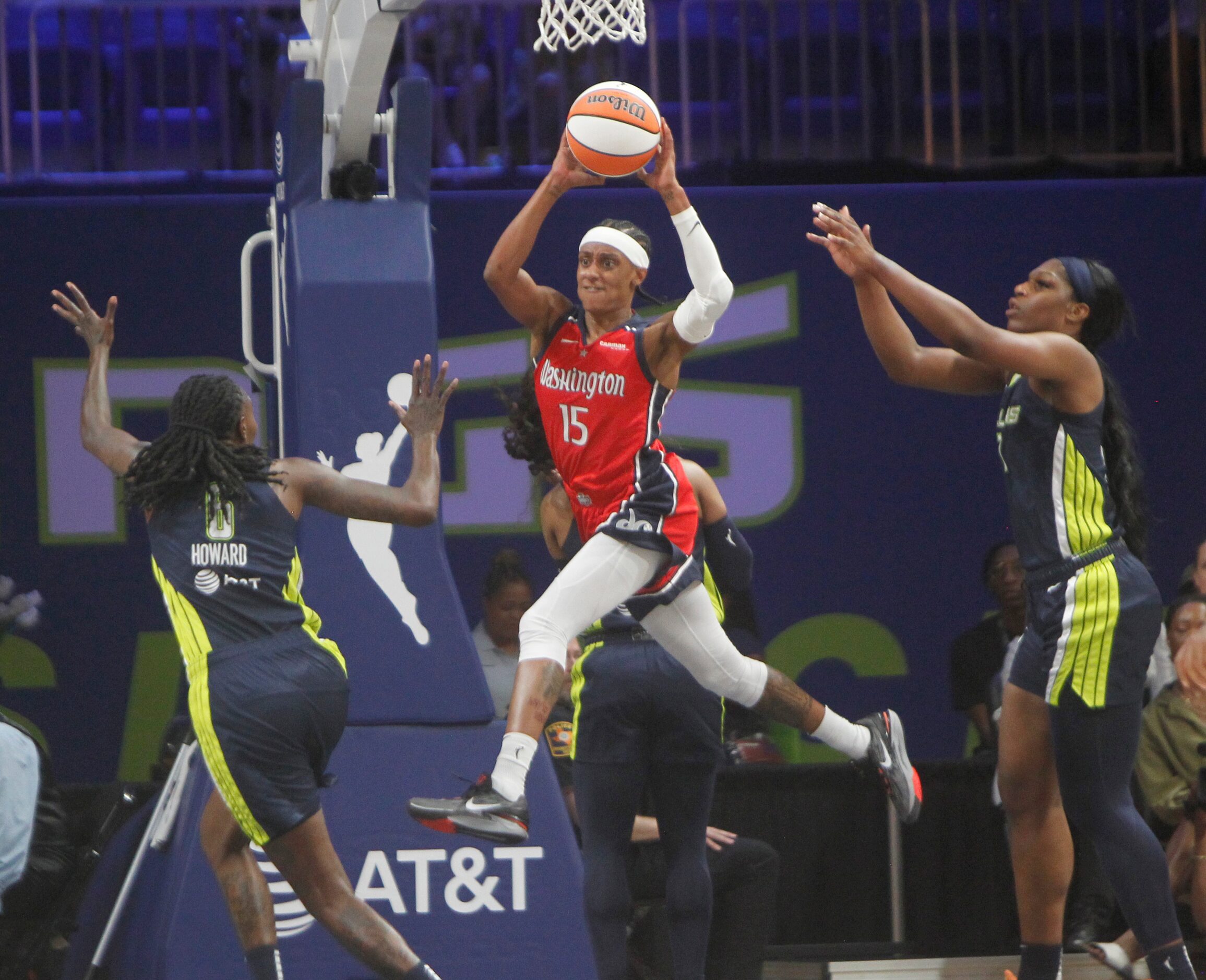 Washington Mystics guard Brittney Sykes (15) looks to pass along the baseline as she is...