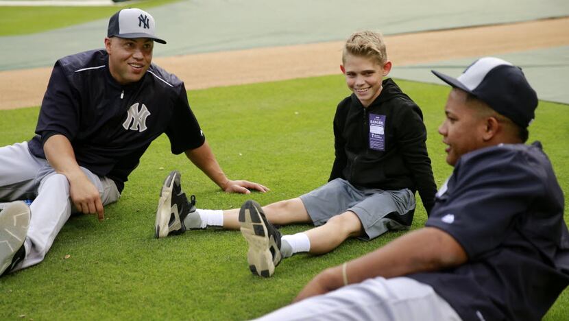 Tracen Visage, 12, of Coppell, Texas got the opportunity to stretch with New York Yankees...