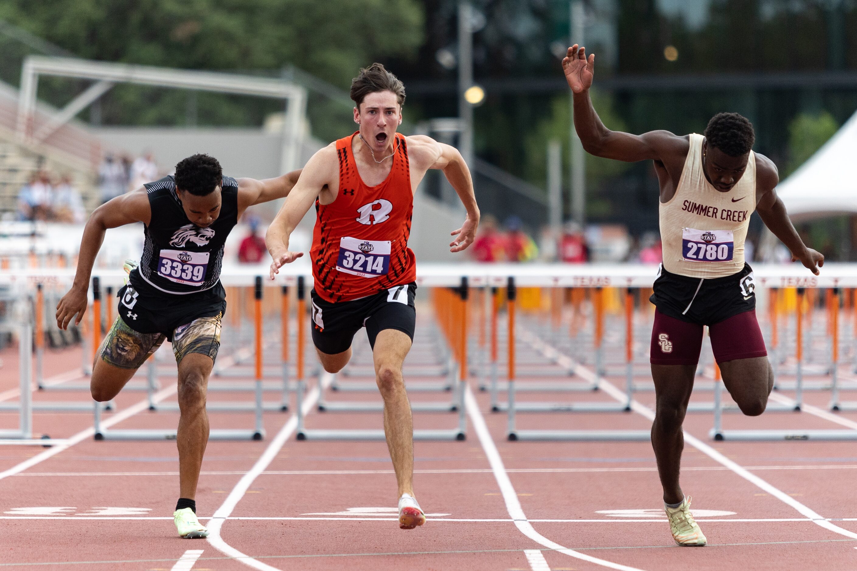 Samuel Alves of Rockwall, center, races toward the finish in the boys’ 110-meter hurdles at...