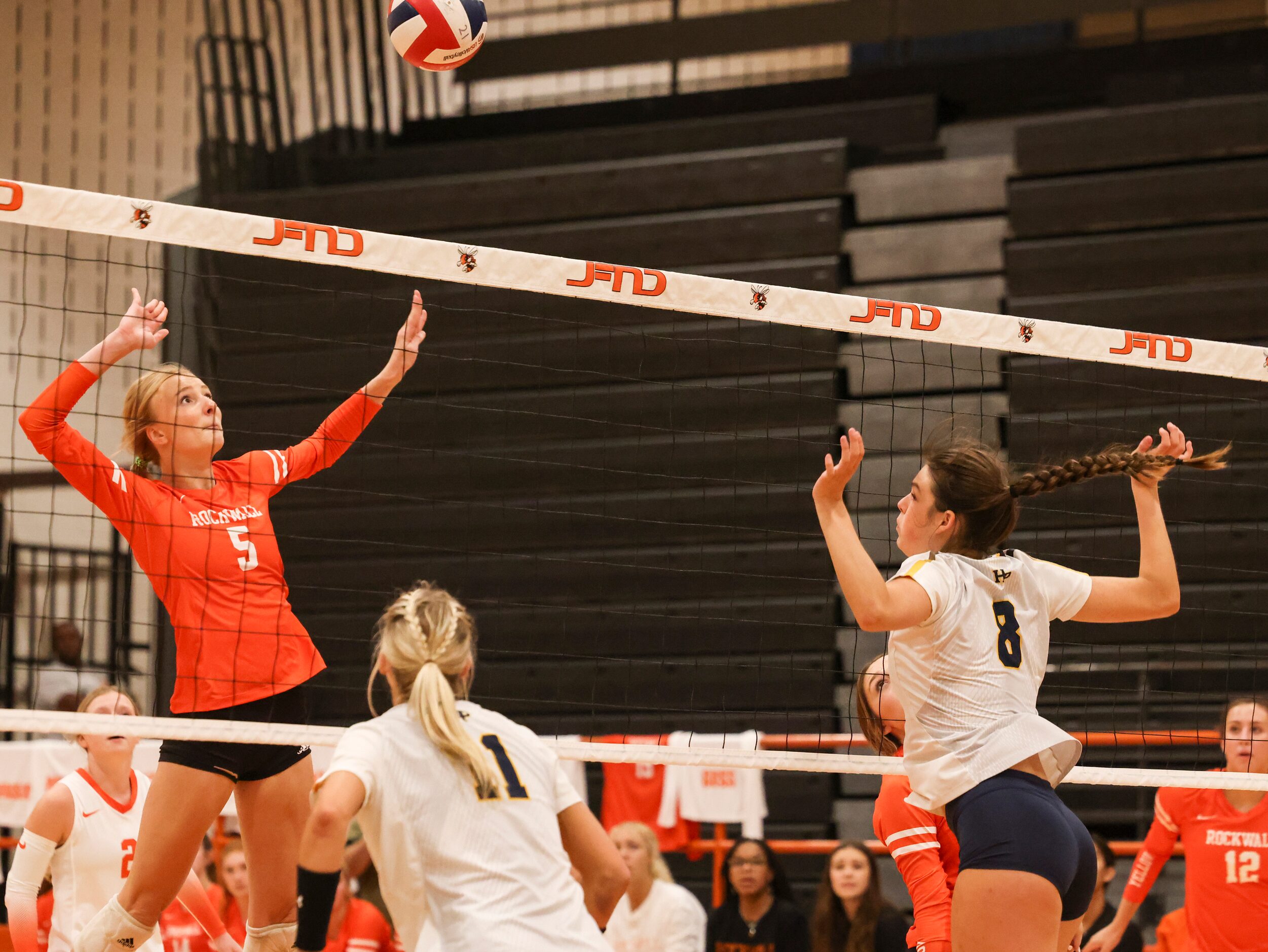 Rockwall High School’s Claire Lowrey keeps her eye on the ball as she winds up to spike the...