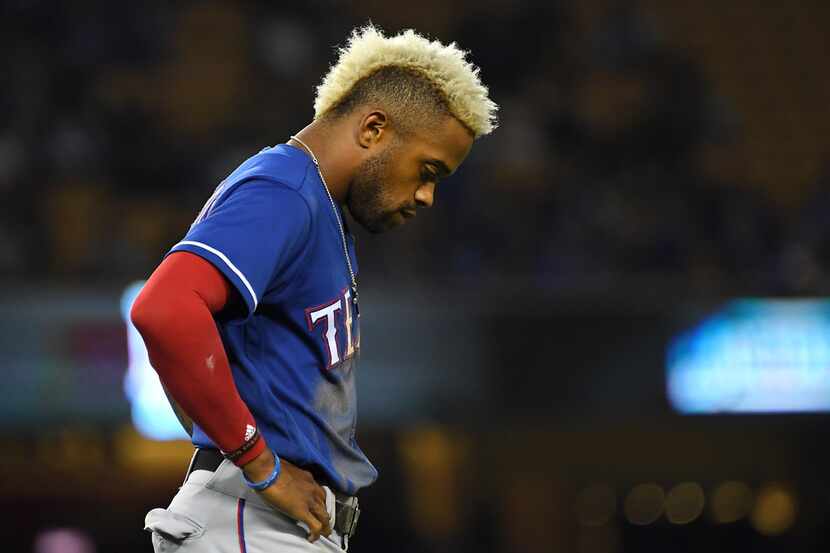 LOS ANGELES, CA - JUNE 13: Delino DeShields #3 of the Texas Rangers stands on the field...