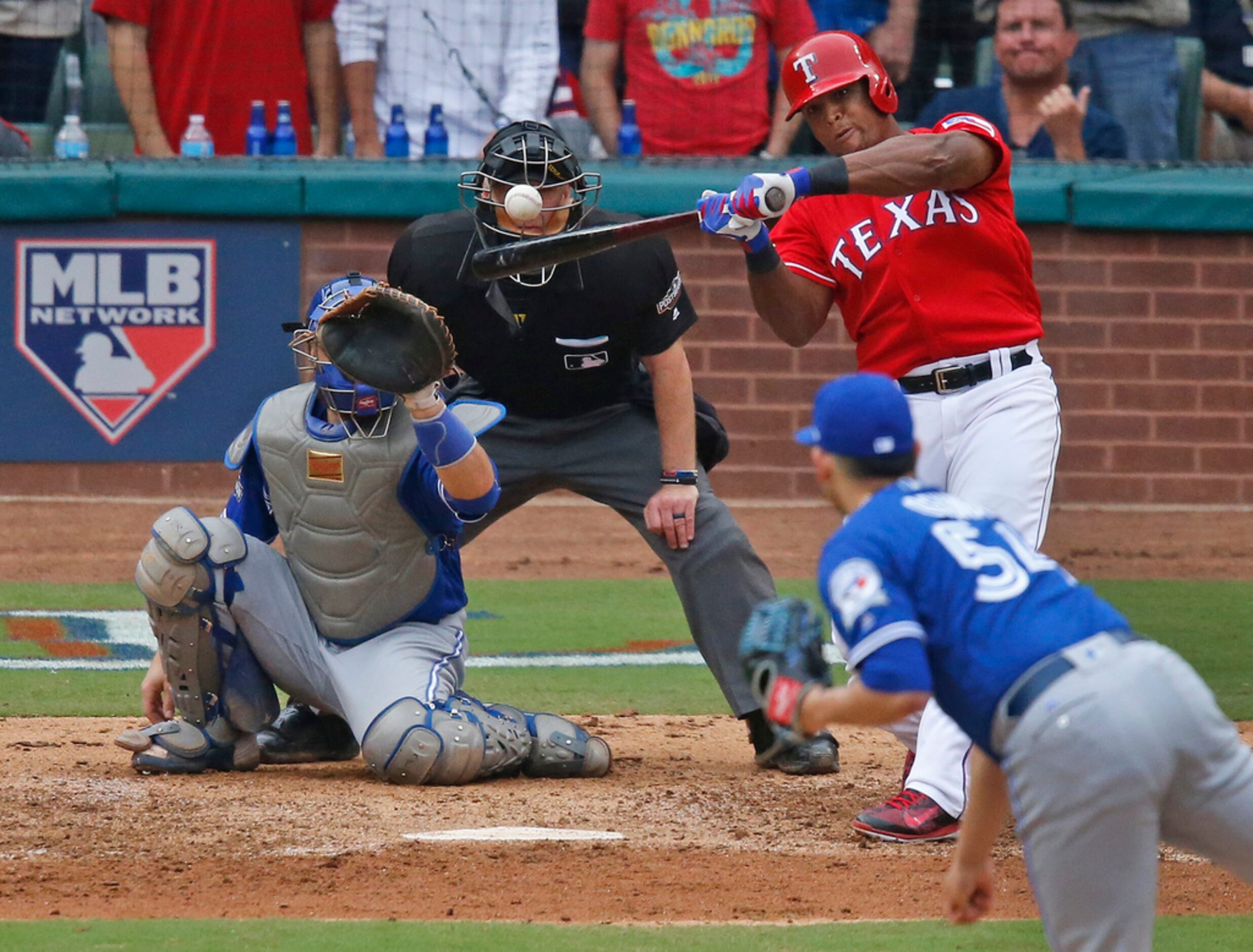 Texas Rangers third baseman Adrian Beltre (29) hits a high pitch during the Toronto Blue...