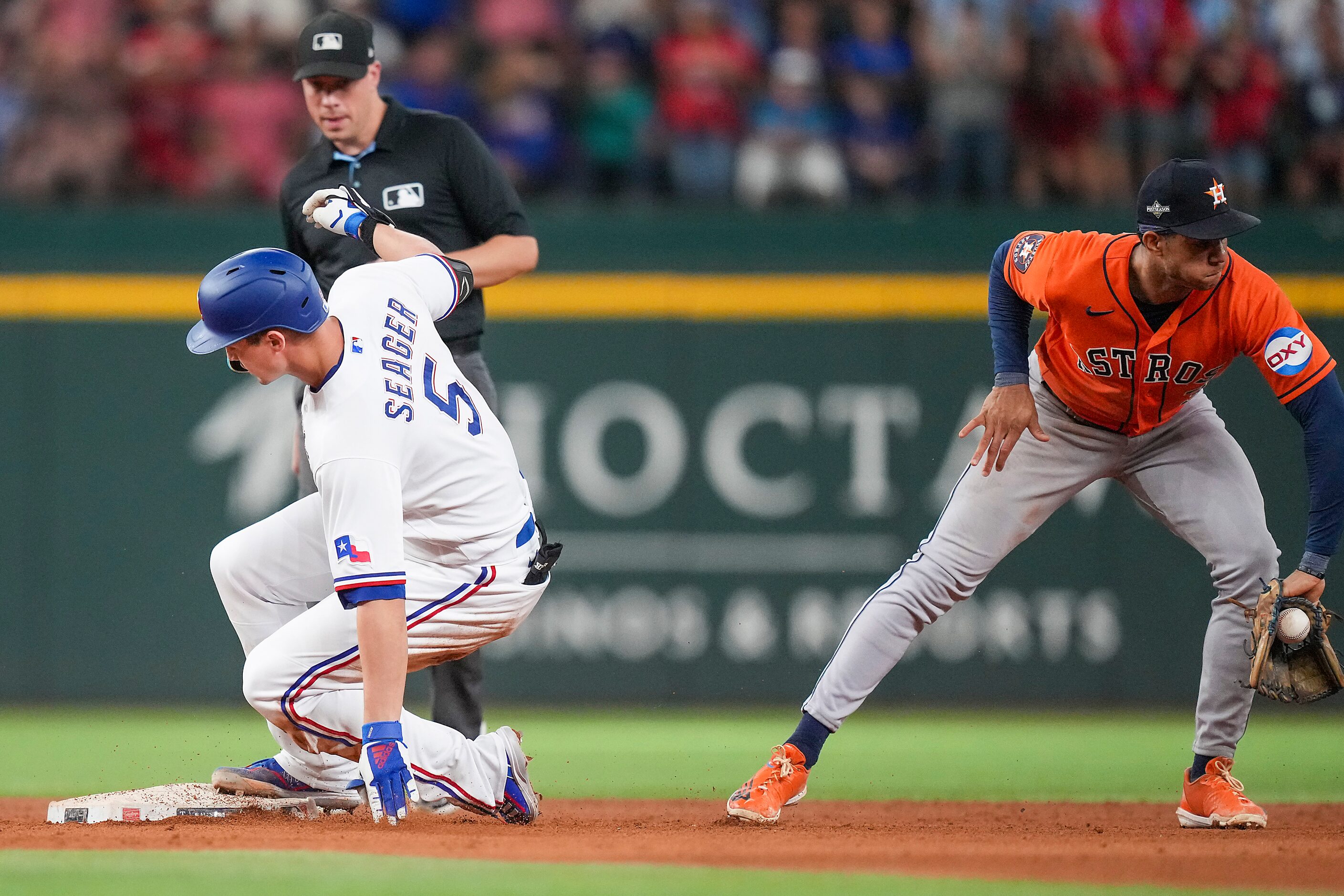 Texas Rangers shortstop Corey Seager is safe at second base with a double during the seventh...