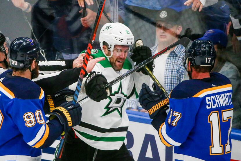 Dallas Stars defenseman Ben Lovejoy (21) gets into a fight with St. Louis Blues left wing...