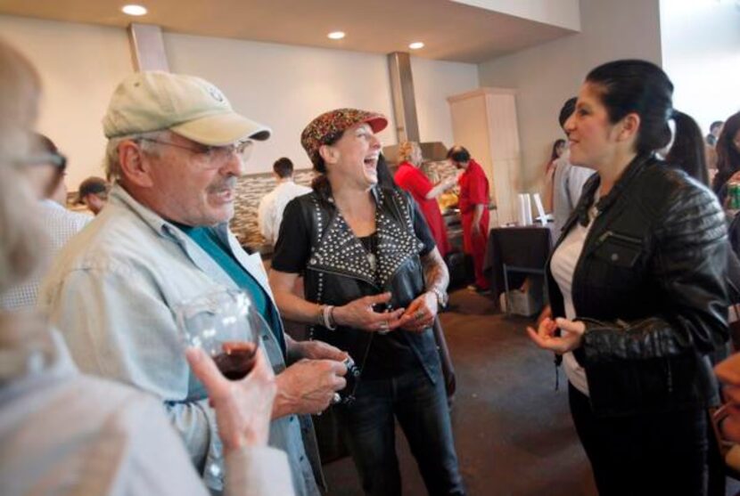 Katherine Clapner (center) of Dude, Sweet Chocolate attended the benefit with her father,...