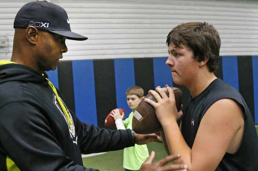 Former Texas A&M quarterback Kevin Murray works as a quarterbacks coach with 16-year-old...