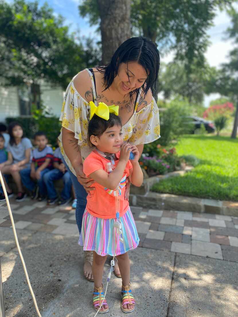 Sarai Tirado stands with her mother, Andrea, at her home in Irving on Tuesday, July 7, 2020....