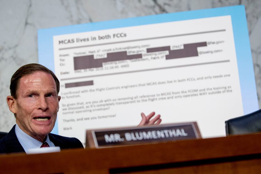 Rep. Richard Blumenthal, D-Conn., displays an email exchange behind him as he questions...