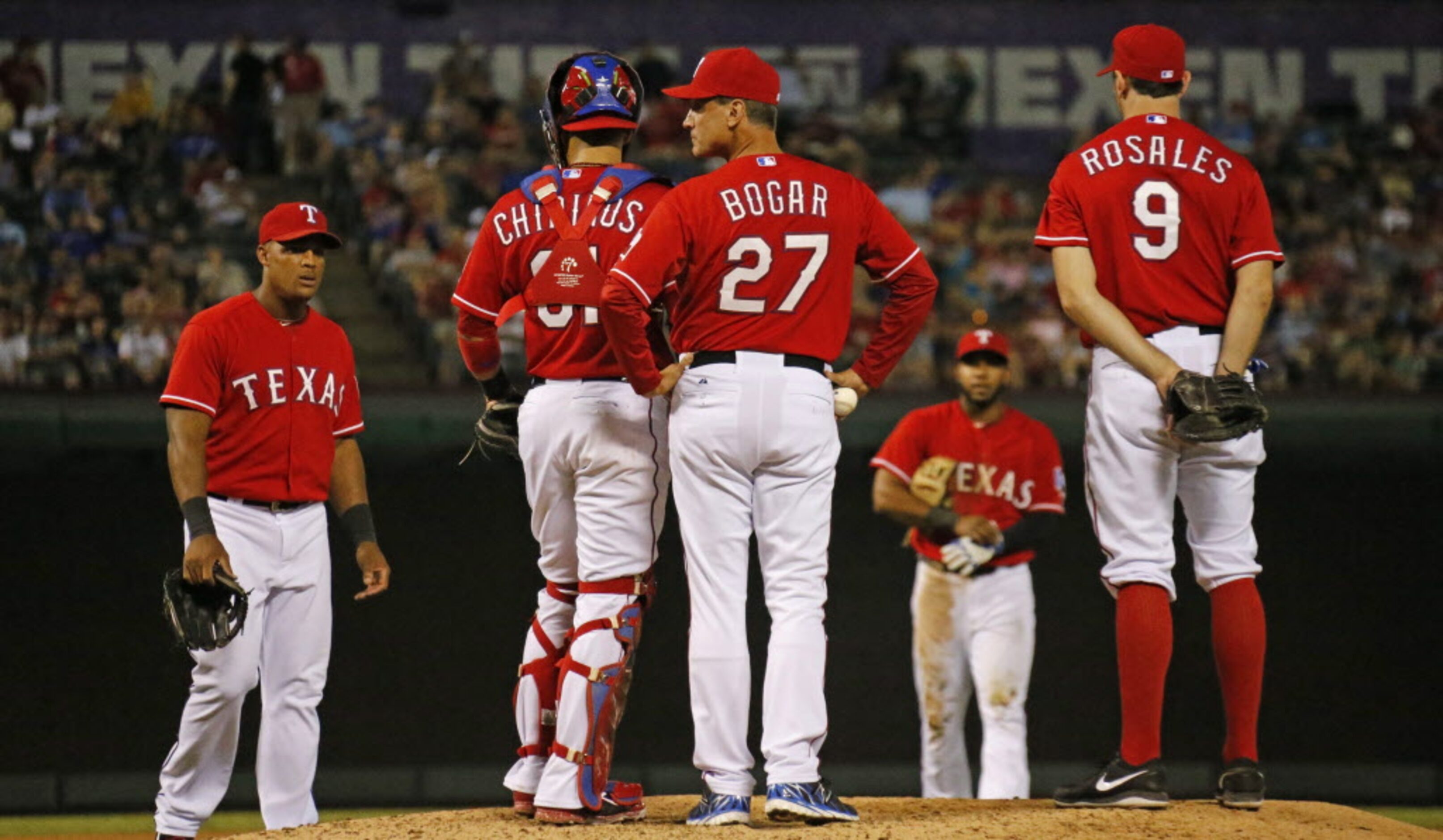 Texas manager Tim Bogar makes a pitching change in the eighth inning during the Oakland...