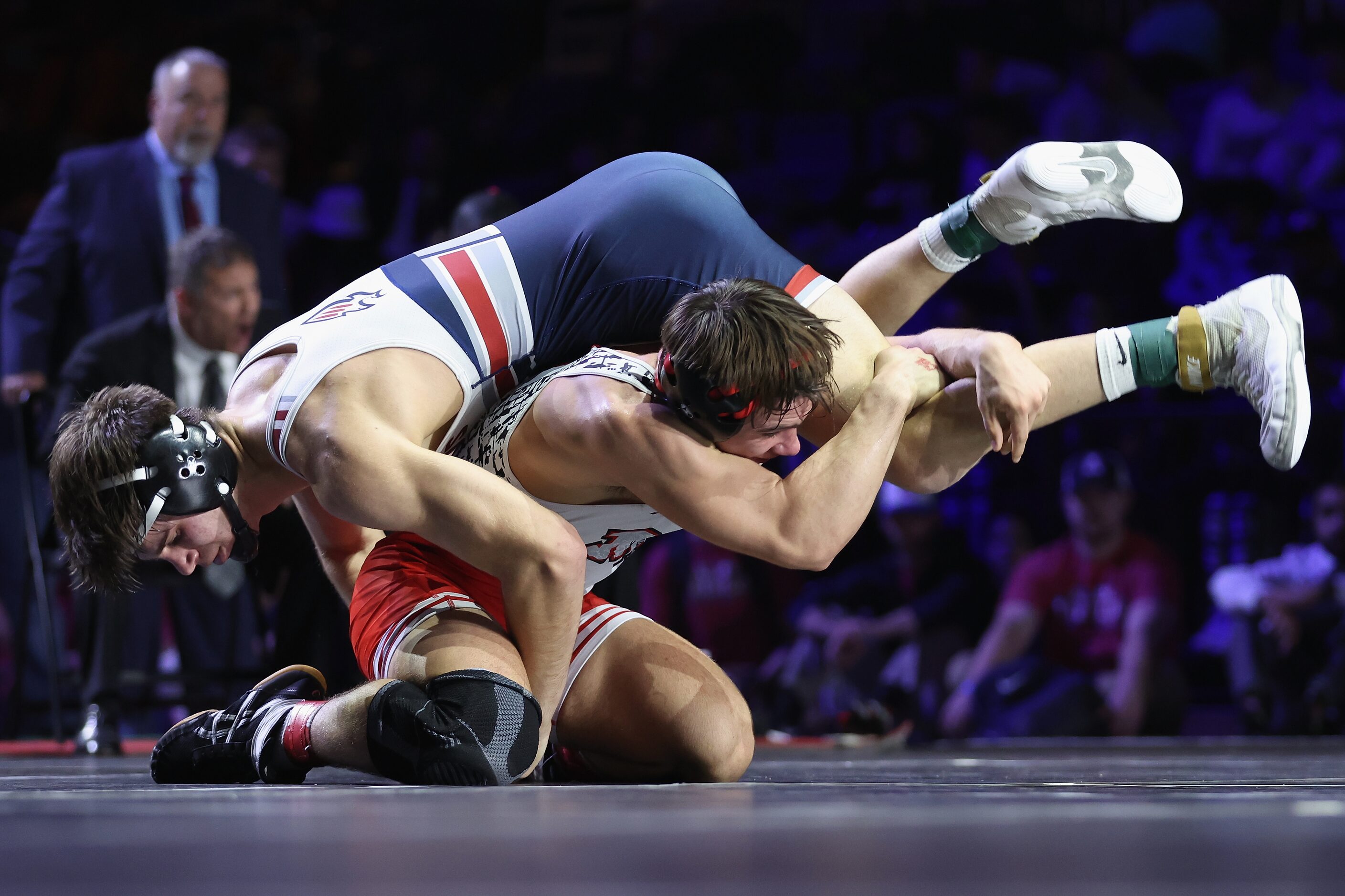 Grayson Carpenter of Arlington Martin (red) competes against Matteo Nikolov of Katy Tompkins...