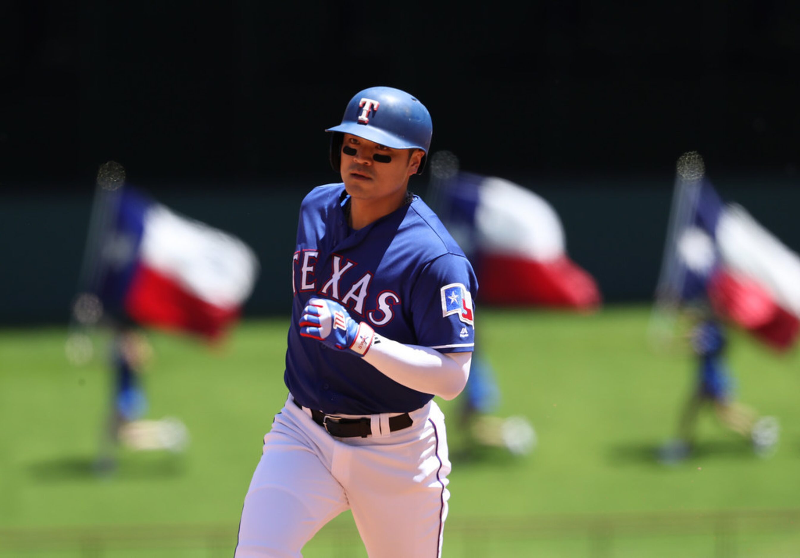 ARLINGTON, TEXAS - MAY 19:  Shin-Soo Choo #17 of the Texas Rangers runs the bases after...