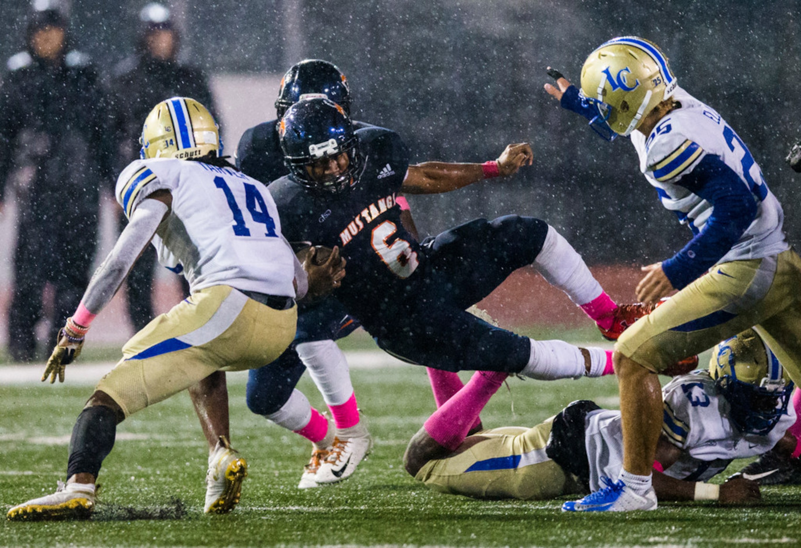 Sachse running back Shon Coleman (6) dives over Garland Lakeview linebacker Gavin Harris...