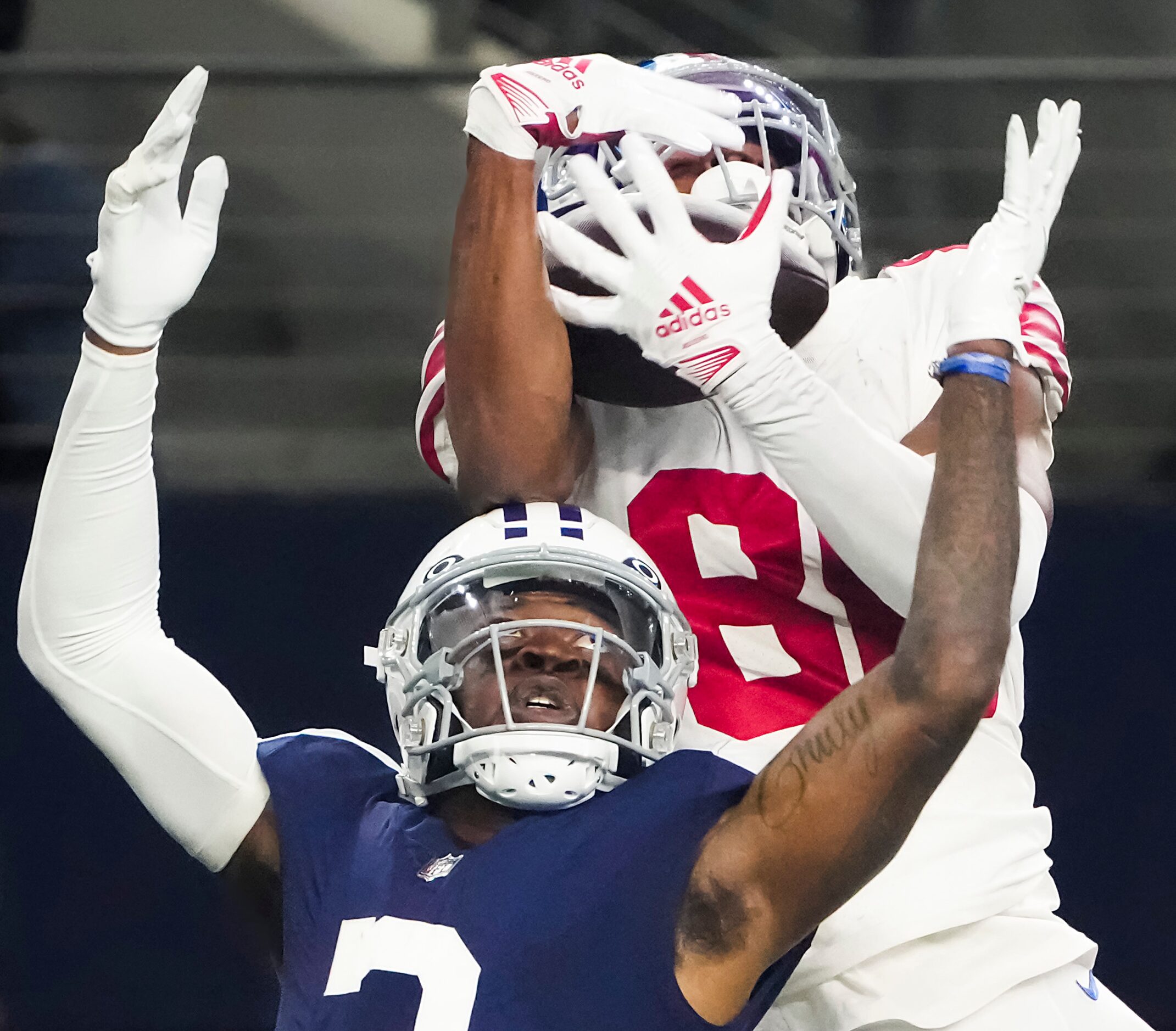 New York Giants wide receiver Darius Slayton (86) makes a catch over Dallas Cowboys...