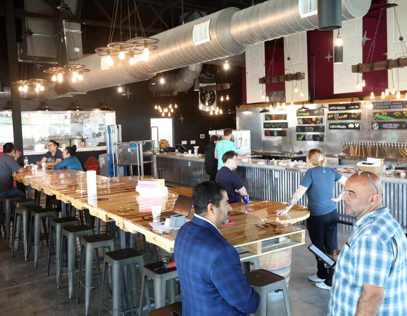 Employees check out the nearly completed interior six days before at Voodoo opens in Grand...