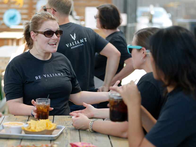 Holly Van Der Jagt (left) talked with Jamaka Duhon during an employee appreciation event at...