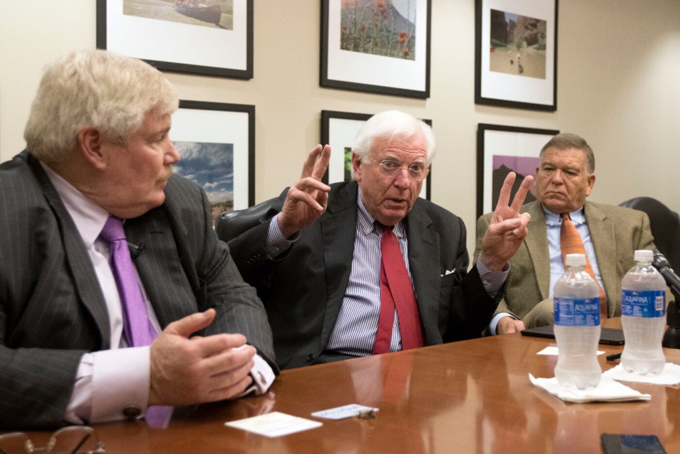 Houston attorney John Eddie Williams, listens as former Texas Gov. Mark White speaks and...