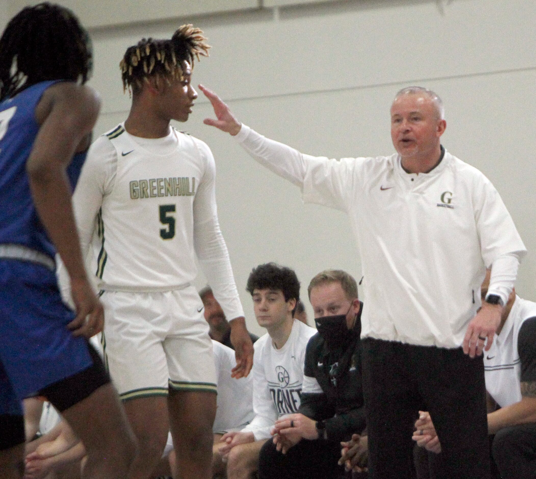 Greenhill's Joey Sims, right, directs his players during first half action against Houston...