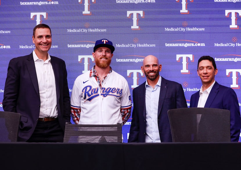 Chris Young, Jon Gray,Chris Woodward and Jon Daniels take a photo together a news conference...