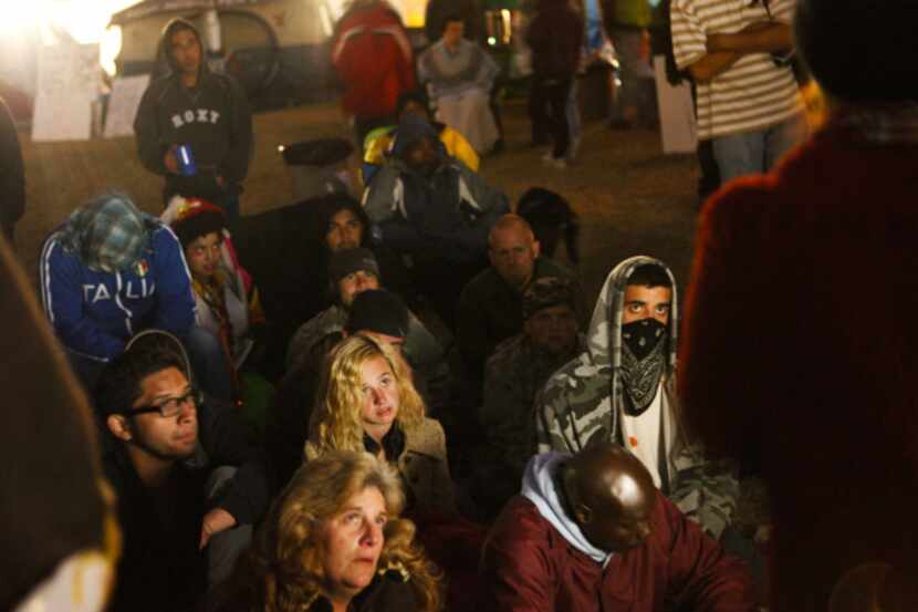 Syrian activist Rania Kisar (back to camera, right) spoke to a crowd of Occupy Dallas...