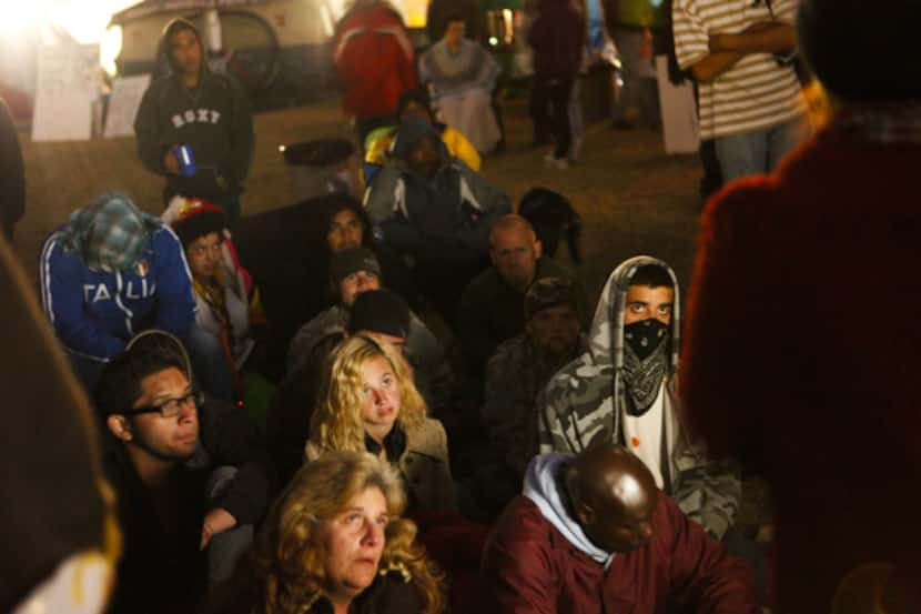 Syrian activist Rania Kisar (back to camera, right) spoke to a crowd of Occupy Dallas...