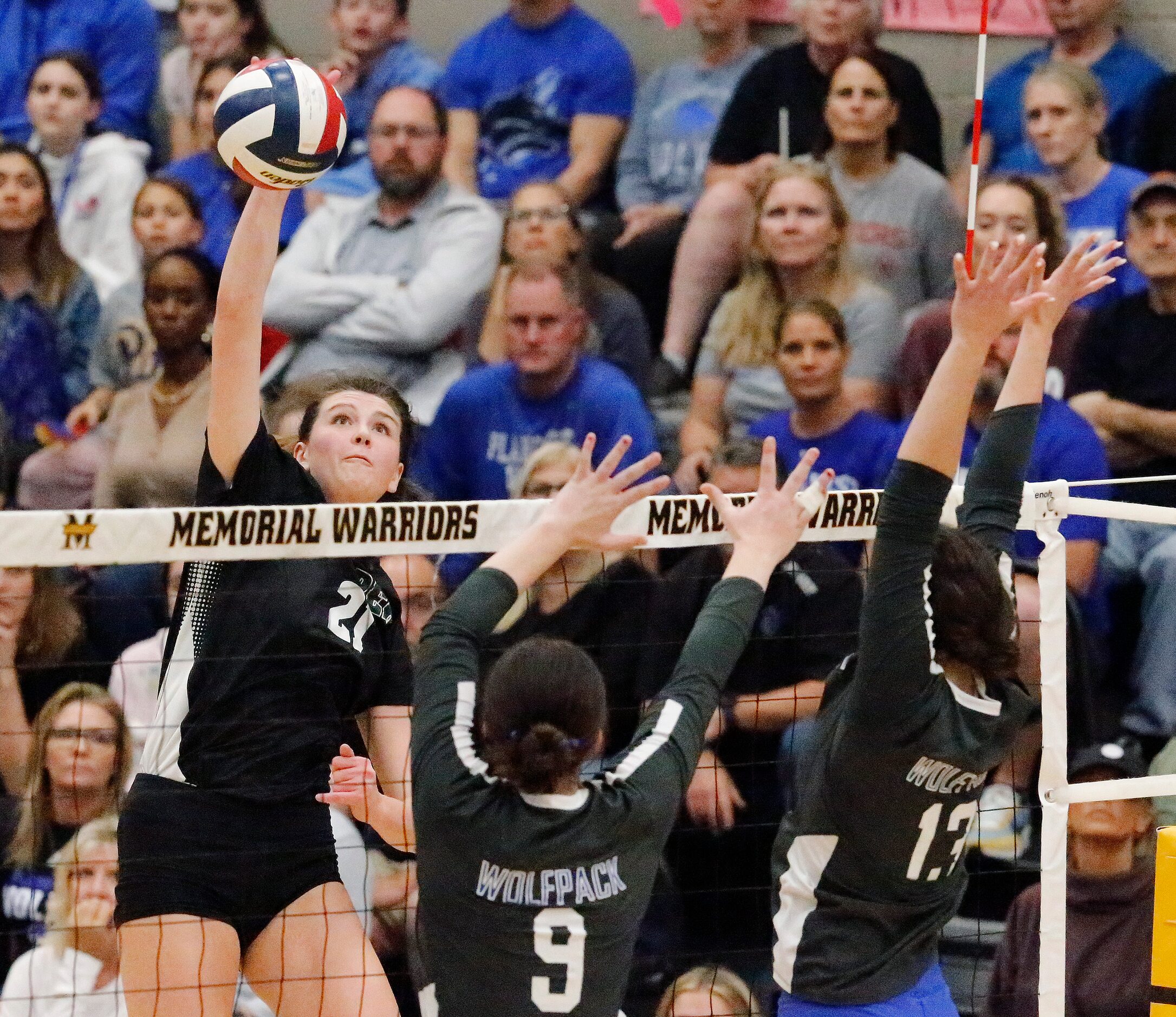 Prosper High School middle Ayden Ames (21) hits over Plano West High School middle Ansley...