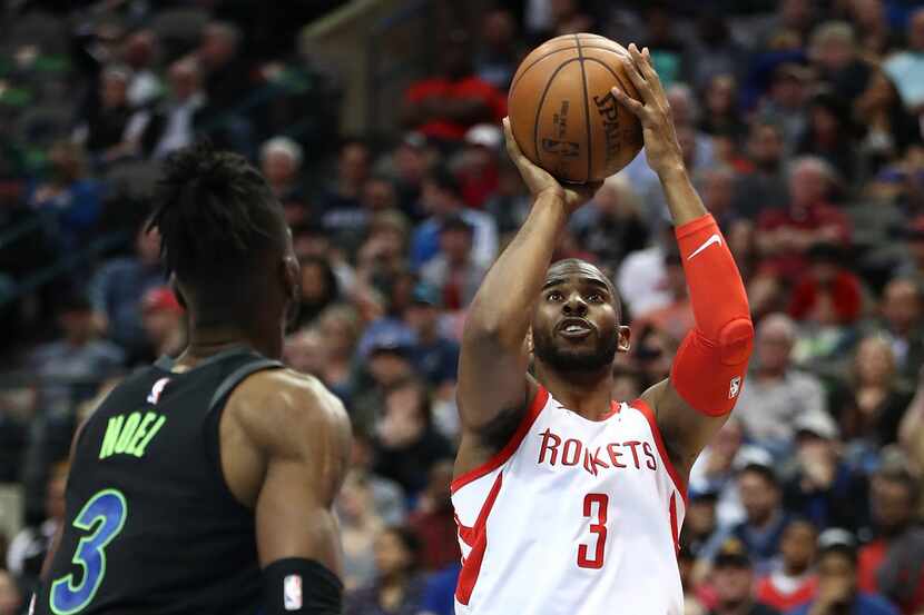 DALLAS, TX - MARCH 11:  Chris Paul #3 of the Houston Rockets takes a shot against Nerlens...