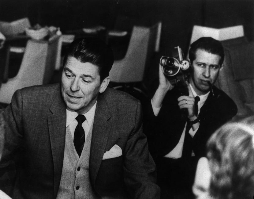 ORG XMIT: S11B429E3 WFAA-TV cameraman Bert Shipp, right, records a visit by Ronald Reagan to...