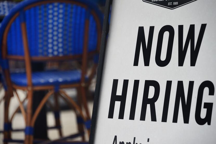 A Virginia restaurant displays a "Now Hiring" sign, a reflection of growing demand for food...