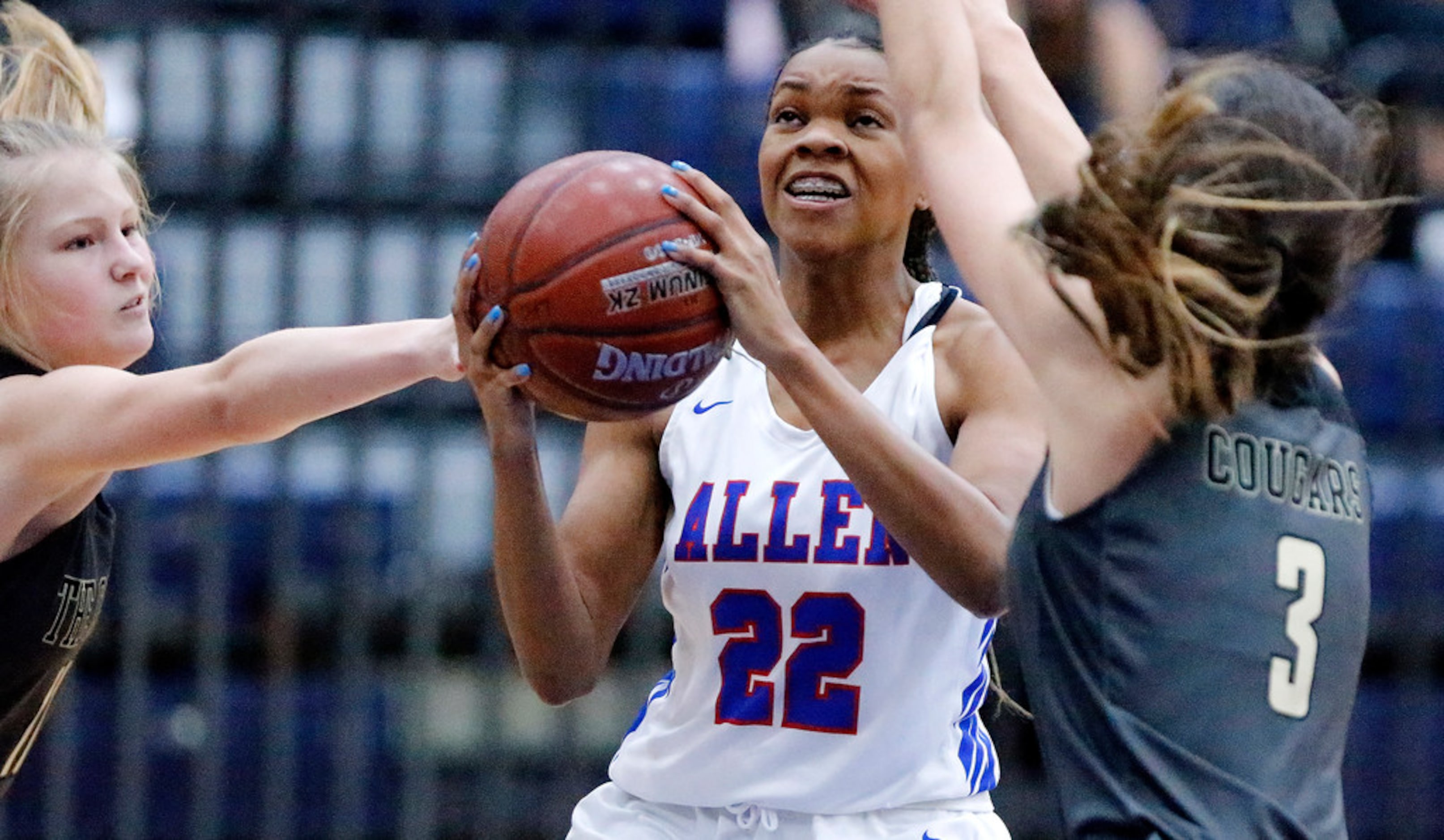 Allen High School Tyler Jackson (22) drives to the basket while The Colony High School...