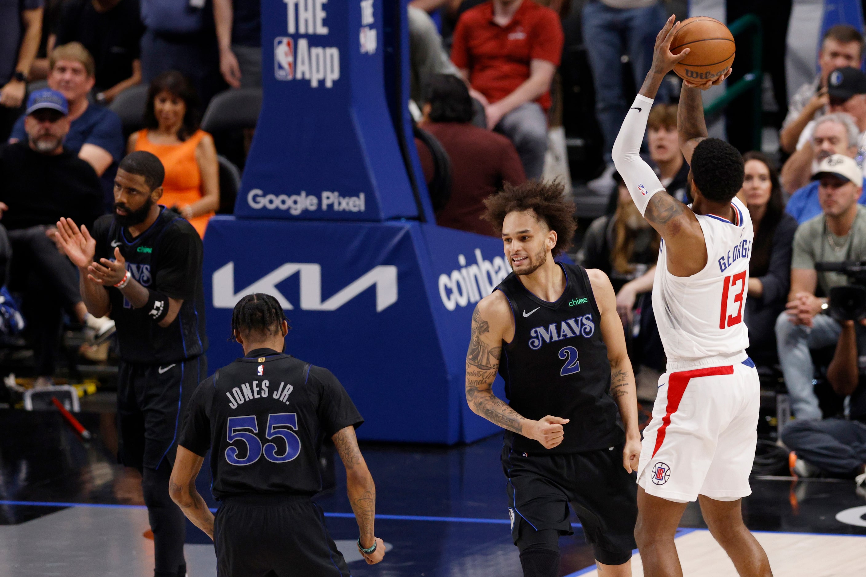 Dallas Mavericks center Dereck Lively II (2) and forward Derrick Jones Jr. (55) react after...