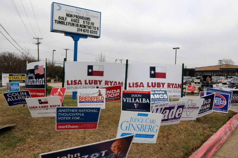 Political signs placed at Fretz Park Branch Dallas Public Library in the Far North Dallas...