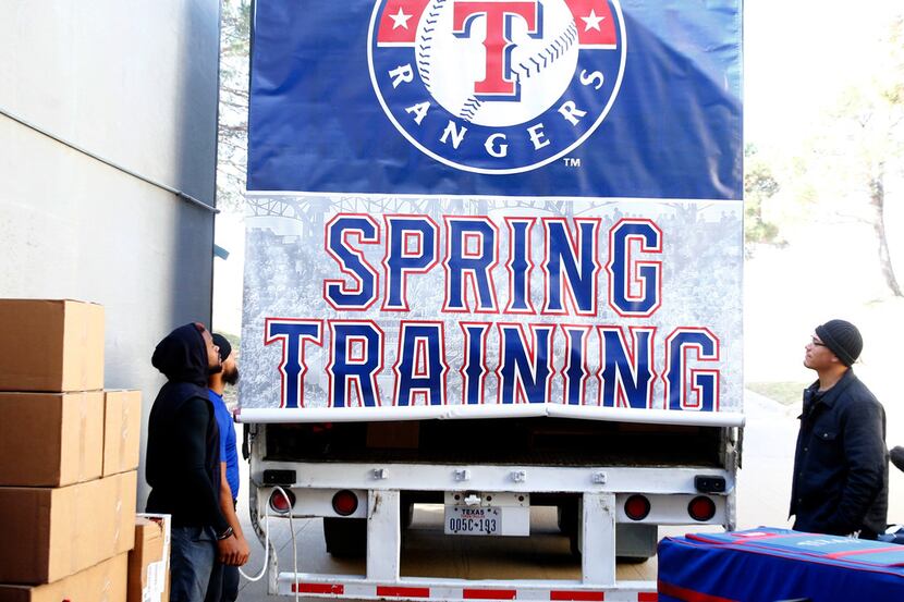 Texas Rangers Delino DeShields, (from left) Rougned Odor and Keone Kela unveil the spring...
