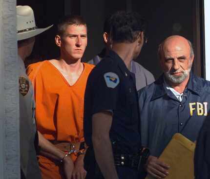 In this April 21, 1995, file photo, Timothy James McVeigh is led out of the Noble County...
