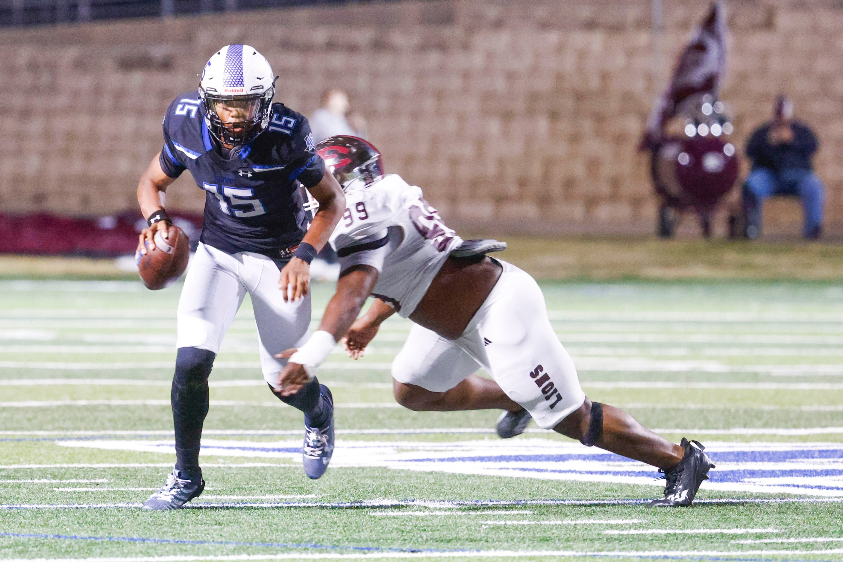 Mansfield Summit High’s QB Demarus Bird (15) gets sacked by Ennis High’s Lonnie Collins...