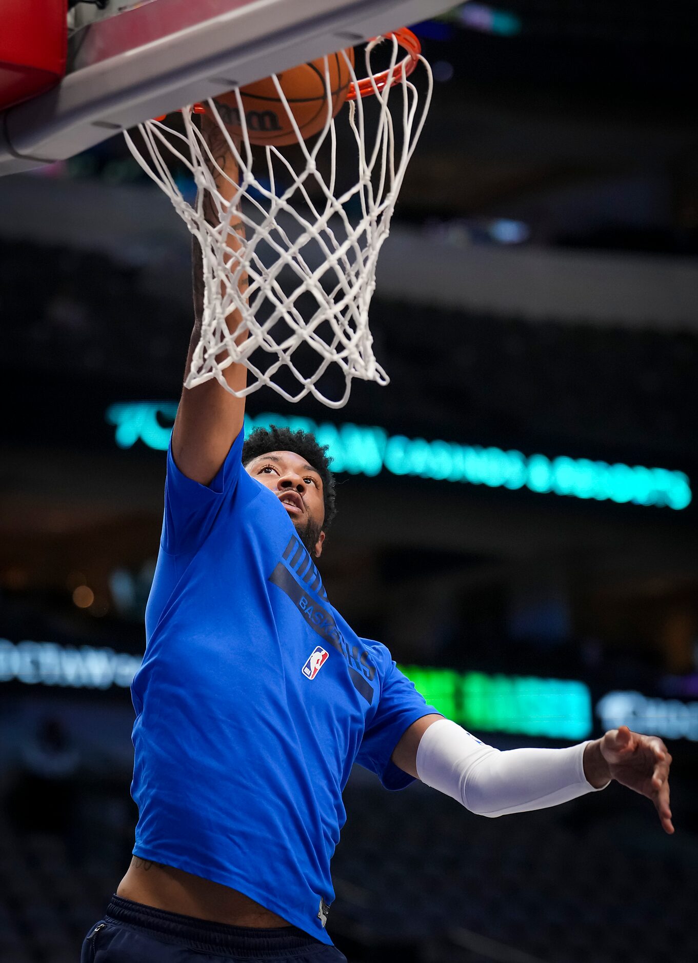 Dallas Mavericks center Christian Wood warms up before an NBA preseason basketball game...