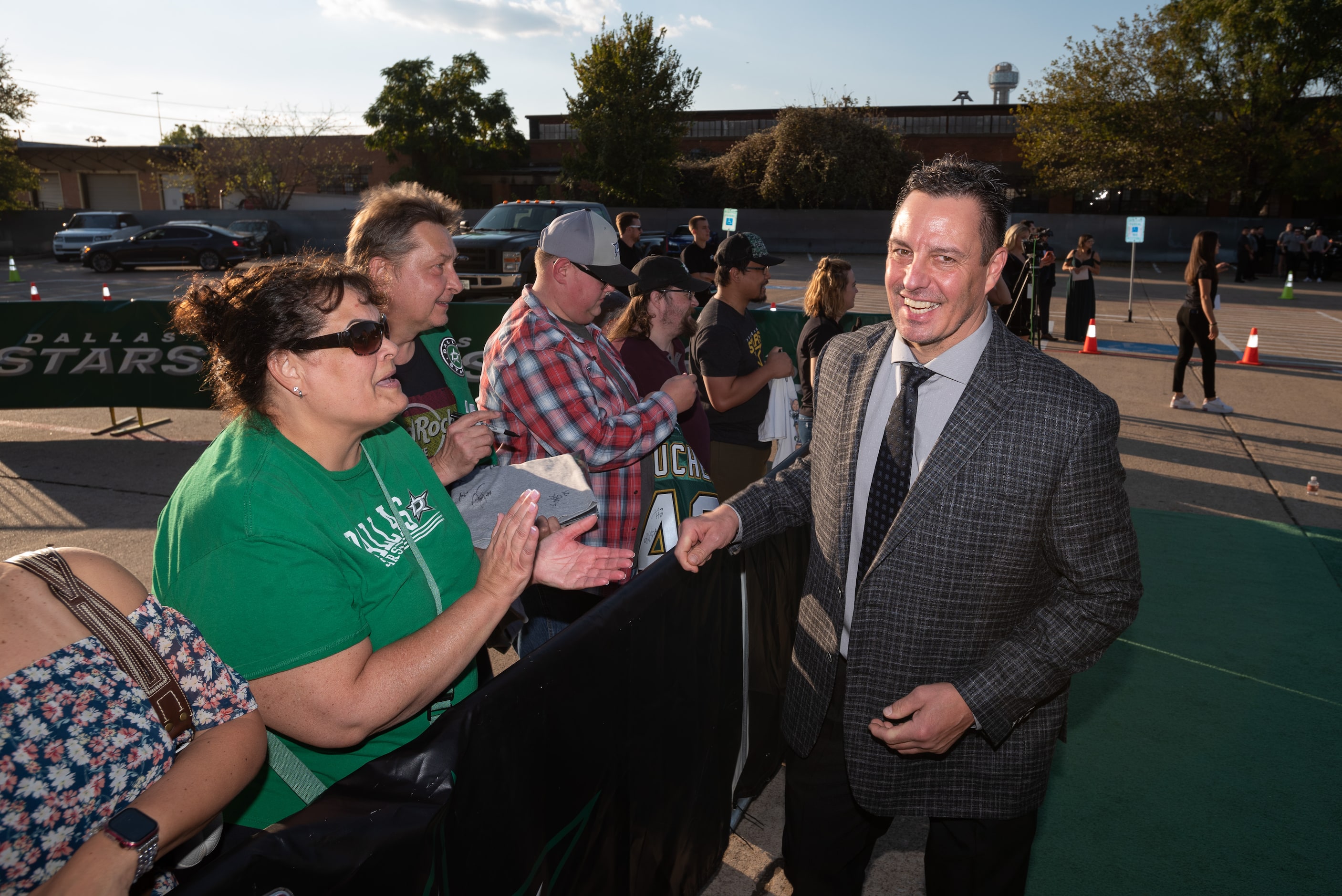 Former Dallas Stars player Richard Matvichuk greets fans as he arrives for the Stars' Hall...