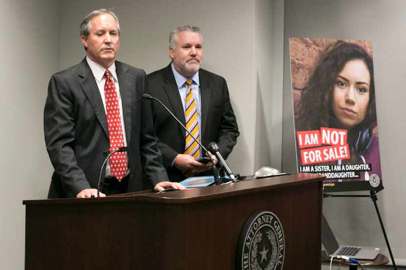 Texas Attorney General Ken Paxton, shown at an undated press conference, called sex...
