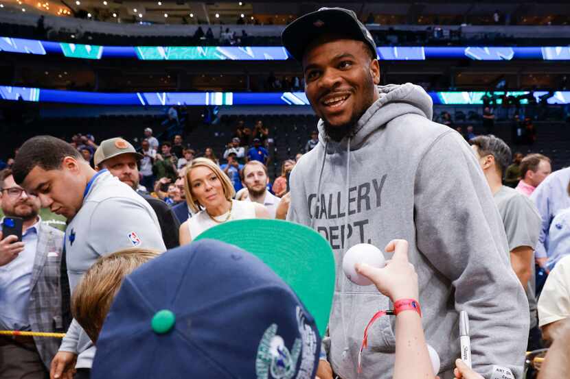 Dallas Cowboys linebacker Micah Parsons reacts towards the crowd while exiting an NBA...