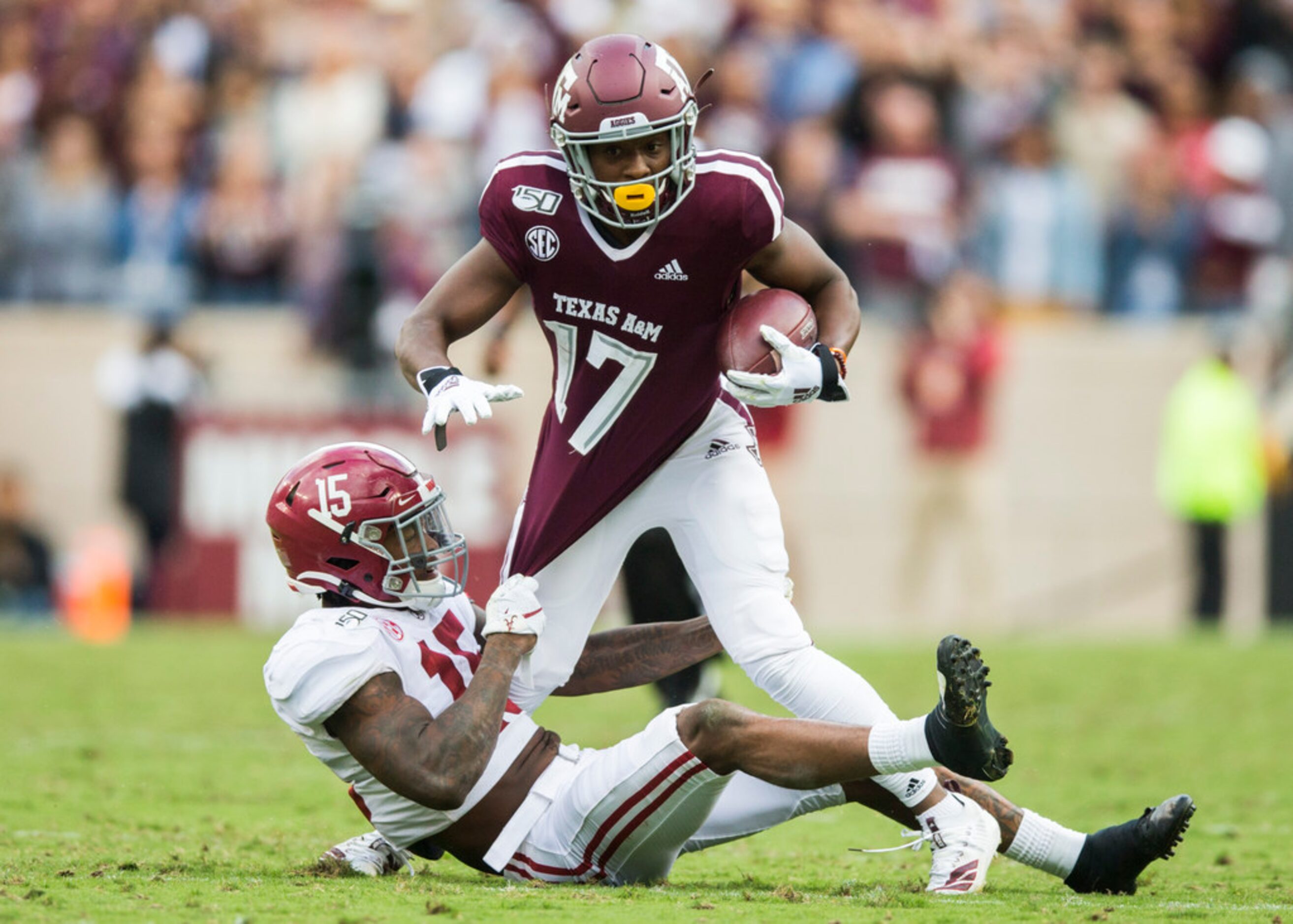 Texas A&M Aggies wide receiver Ainias Smith (17) is tackled by Alabama Crimson Tide...