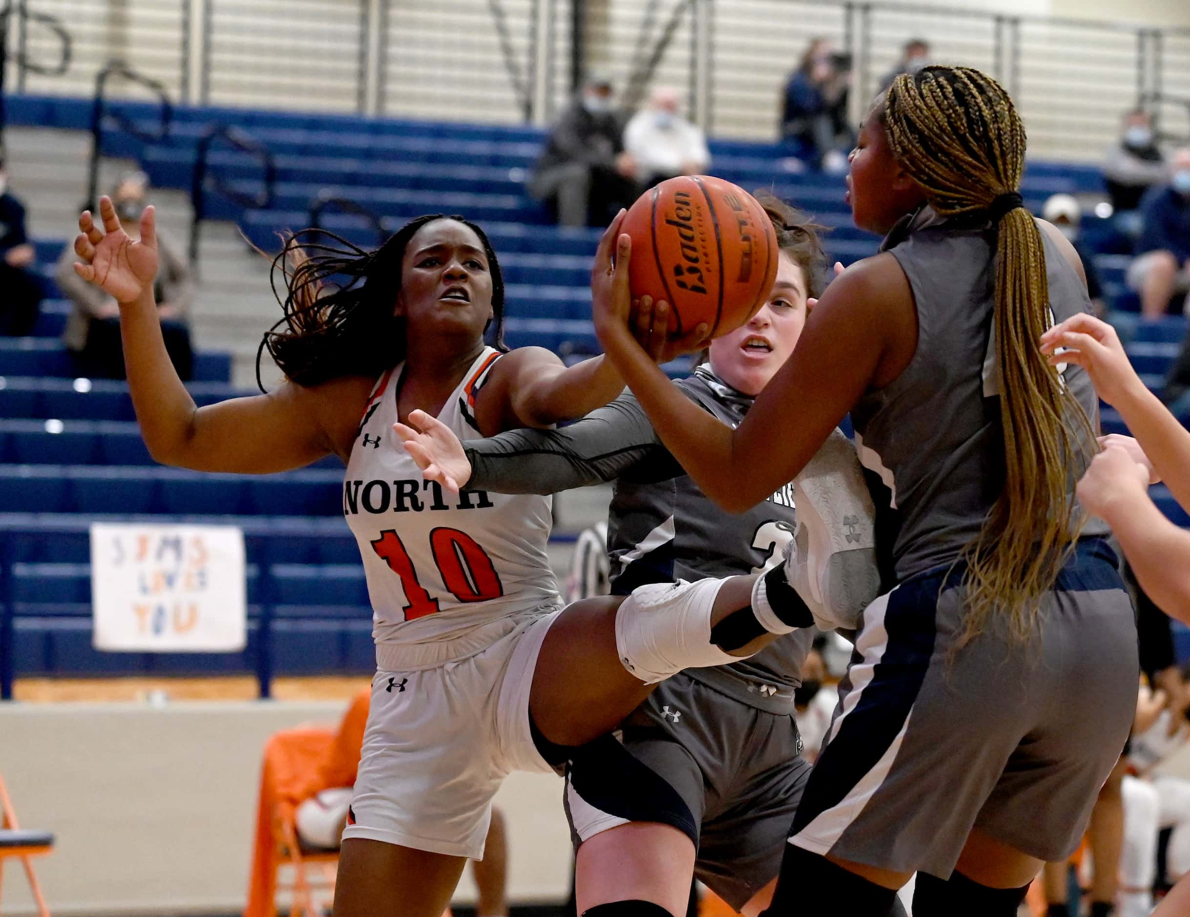 McKinney North’s Kaelyn Hamilton (10) goes after a rebound with Wylie East’s Kiley Hicks,...
